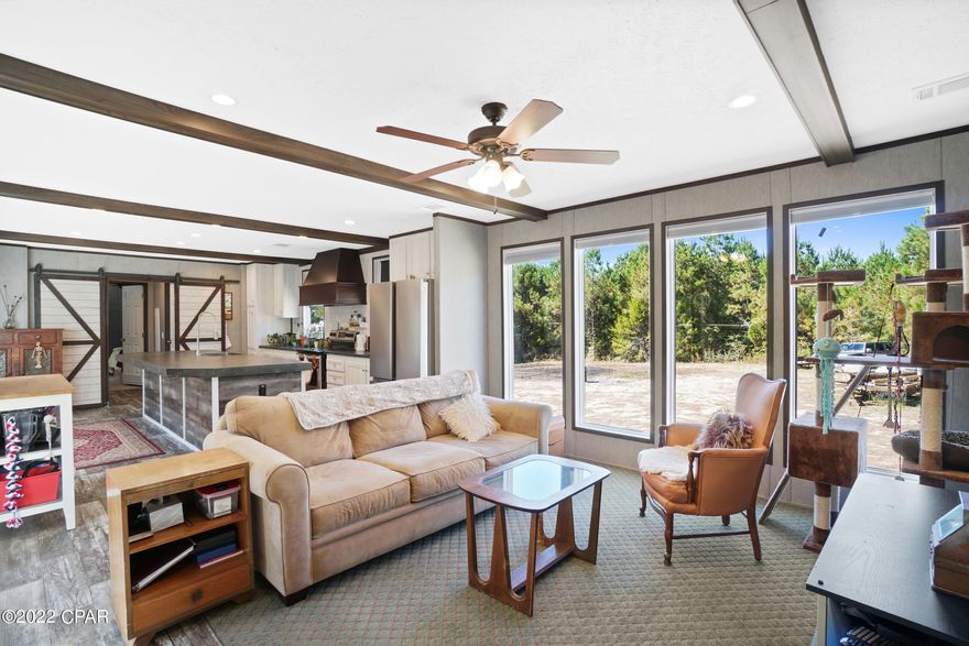 CURRENTLY UNDER CONTRACT, SELLER WILL CONSIDER BACKUP OFFERS. Tremendous opportunity! 2022 Clayton 3 BR 2 BA manufactured home with rain gutters on 20 pristine acres of beautiful land, new well, new large capacity septic with lateral field, new underground electric from pole to house, 50 amp facilities for RV with septic and water hookups. A new outbuilding, fully powered and air conditioned with split unit, housing large capacity refrigerator and freezer, washer and dryer and storage space is adjacent to the home. A large 40 FT cargo storage container is on site providing additional storage. Included in the sale are all appliances.