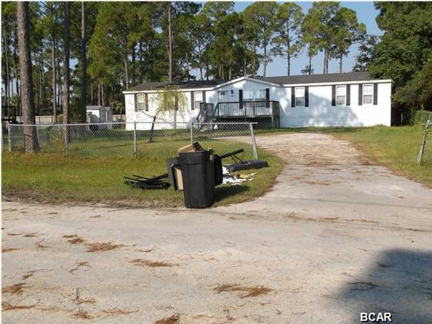 Manufactured, double wide home with front & back decks, located near the Bay. You will find a formal dining room, den with fireplace, master bedroom with office, garden tub in master bath, split bedroom plan, refrigerator, dishwasher, cooktop, seperate oven, microwave, central heat & air, washer & dryer connections. Please not pet/no smoking - view by appointment through November 24th, 2014/then available to view by checking out a key.