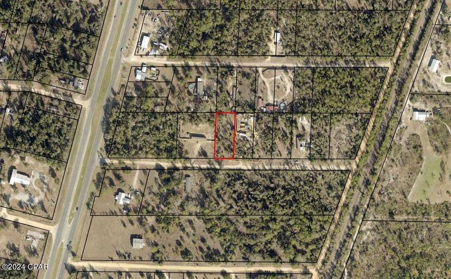 HALF AN ACRE LOT - LESS THAN 500 FEET FROM HWY 231. Build your dream home on this high and dry cleared lot. Seller has spent thousands in upgrades to include a well, power pole, and a fence that runs the length of both sides of the lot. Conveniently located near a piggly wiggly.