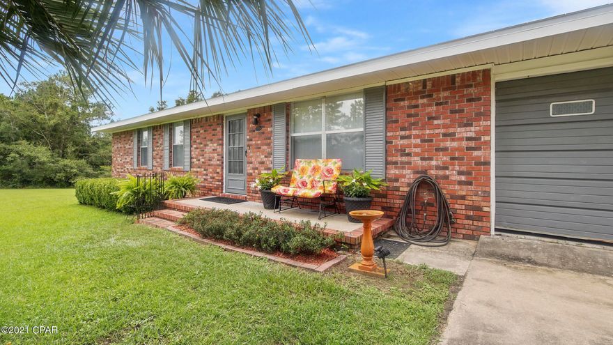 Come And Get It! This Quaint 3 Bedroom 2 Bath Home with Pond Resting On 5+/- Acres has so much to offer! This home features an open main living, kitchen, and dining area concept, with parquet flooring throughout. The kitchen area boasts stainless steel appliances accented and highlighted by white cabinetry with stainless hardware. On the south end of the home, you will find the 2 guest rooms and full guest bath, as well as the Master Suite. The Master Bath features a walk-in Shower and single pedestal sink. Outside, the home features an open front porch, and roomy screened in back porch perfect for getting out of the and relaxing. The property also features an open patio area that is ideal for grilling and light entertainment. The property also boasts a large pond on the western side! This property is wonderfully located 1+/- Hour from Panama City Beach and the Worlds Most Beautiful Beaches, as well as Beaches International Airport! Schedule your showing on this property today!