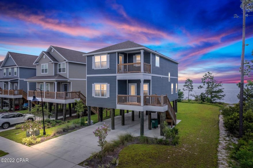 This home has a beautiful view of East Bay. Large backyard to enjoy a winter fire pit with a view of the bay. The home is 4 bedroom 3.5 baths. This home has double Master bedrooms, one is upstairs, one is down. Kitchen is open to the living room, dining room and back covered balcony. Laundry room is located on the second floor. There are two spare bedrooms on the second floor as well. Must See!!!