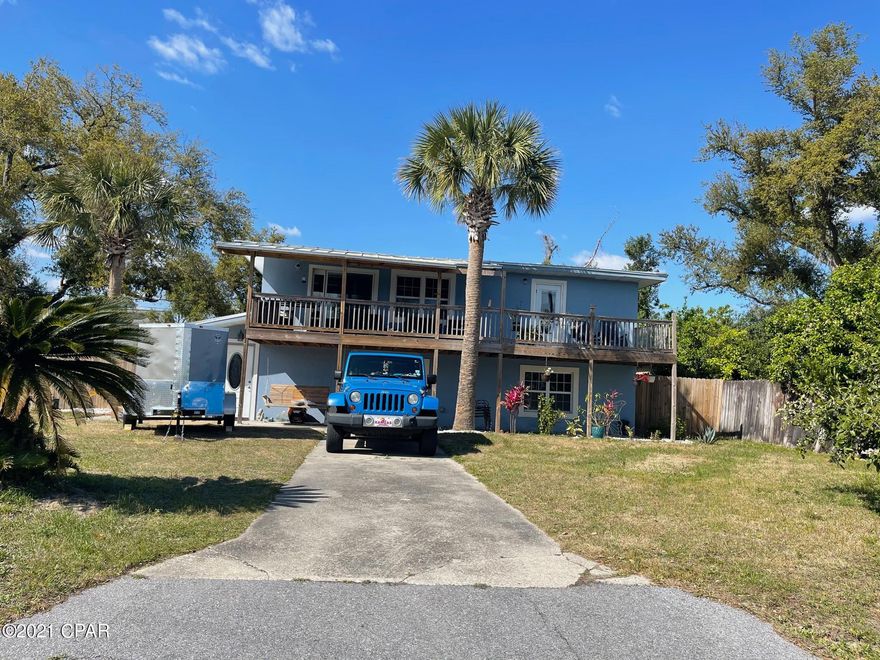 COMP PURPOSES ONLY!!! This beautifully renovated home is in the heart of Lynn Haven and has gorgeous views of Anderson Bayou from the balcony.  Features luxury vinyl flooring throughout, an newly renovated open concept kitchen/ dining area with slate appliances, solid surface counter tops,  an island, cabinets, backsplash, walk in pantry, open face shelving, and a built-in wine bar.  The lower level features a large master suite with a walk-in closet and jetted tub in the on suite bathroom. Home is conveniently located near shopping, restaurants and the beaches.