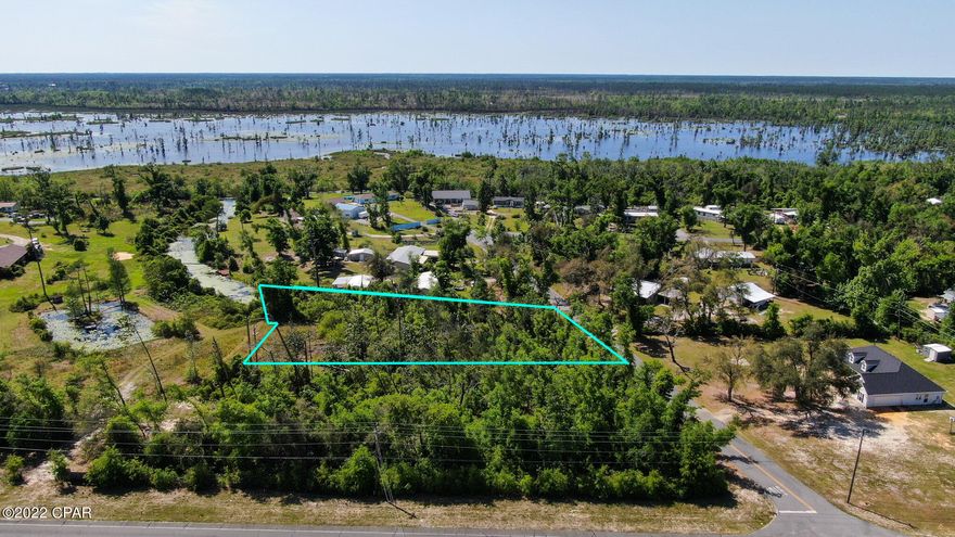 Beautiful wooded lot in the neighborhood of Leisure Acres in Youngstown. No HOA and on a paved road at just over half an acre, this property is secluded and has a small creek that leads out to Deer Point Lake. Well, septic, and electric needed. Property appraisers site says Piza Circle, the property is on Miller Circle.