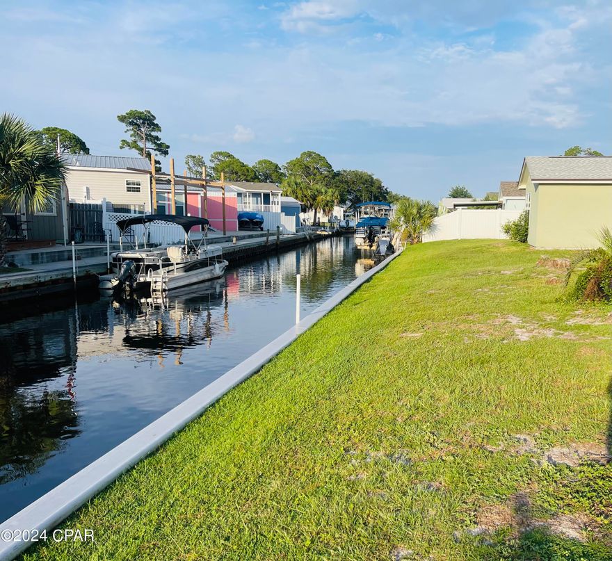 Newly remodeled and ready for you! Ever wanted to park your boat in your backyard without breaking the bank? This beautifully updated 1 bedroom, 1 bath unit with 22' +/- of deeded canal space could be exactly what you're looking for. Located in a quiet, gated community with pavilion, two pools and tennis courts it's perfect as a long term rental investment or your second home getaway. Call to see today!