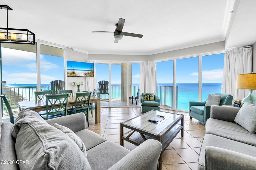 Welcome to one of the most sought-after offerings in Panama City Beach--Tidewater Beach Resort Unit 717. This rare east-facing corner residence showcases the highly desirable ''J'' floor plan, highlighted by an expansive wraparound balcony that truly sets it apart. Positioned at the ideal elevation, enjoy sweeping views of the emerald Gulf waters and sugar-white sand below. Inside, 9-foot ceilings and walls of glass fill the space with natural light, creating a bright, open living area designed to capture panoramic coastline views and unforgettable sunrises. Thoughtfully configured for both personal use and strong rental performance, the condo comfortably accommodates up to 10 guests. The layout includes two spacious master suites, an additional guest bedroom, and a custom built-in bunk area with wainscoting for added coastal character--ideal for families or larger groups. The open-concept kitchen and living area flow seamlessly together, featuring granite countertops, stainless steel appliances, coastal finishes, and uninterrupted Gulf views. This unit has been meticulously maintained and is offered fully furnished with high-end pieces, making it a true turnkey opportunity for investors or second-home buyers. Step onto the oversized balcony and take in the breathtaking scenery--watch seasonal fireworks near the pier or simply relax as the sun sets over the water. Whether you're seeking a private retreat, full-time residence, or high-performing rental, this property delivers on every level. Convenience is key, with close proximity to the elevator and three allotted parking spaces in the garage, connected via a covered skywalk across Front Beach Road. Built in 2008, Tidewater Beach Resort is ideally located on the desirable west end of Panama City Beach, just minutes from Pier Park's premier shopping, dining, and entertainment. The resort offers one of the most comprehensive amenity packages in the area, including over 600 feet of beachfront, multiple outdoor pools, a heated indoor pool, fitness center with Gulf views, on-site movie theater, coffee bar, and an exclusive top-floor owner's lounge. Experience Gulf-front living at its finest--where space, views, amenities, and location come together in one exceptional offering. All measurements deemed accurate; buyer to verify if important.