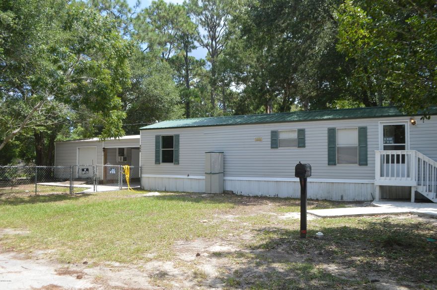 Great starter home or investment property. The home has a New ROOF and and newer Hot water heater. New carpet, new paint, etc. The home sits on a nice corner lot that is fenced in. There is a very large shed with carport included on the property. Why rent when you can own?