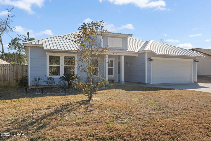 'CURRENTLY UNDER CONTRACT, SELLER WILL CONSIDER BACKUP OFFER.'  Recently constructed in 2021 this 4 Bedroom is in a prime location less than a mile to the Beach and various Parks make it a very desirable home. Pier Park, Frank Brown Recreation Park & Aquatic Center and a short walk to Scott Field Park enhances its appeal, especially for those seeking a vibrant and convenient lifestyle. Charming curb appeal, 2 car garage, 8' privacy fence, Pergola & large lot with plenty of room for a pool. The open-concept layout and the inclusion of Shiplap walls in the dining, living room, and primary bathroom add a touch of character.  With a seamless flow between the living, dining, and kitchen areas, with vinyl flooring throughout, Tray ceilings in the living area and primary bedroom. The open kitchen is a chef's delight, featuring stone countertops, Shaker cabinets, Subway backsplash, large 8' bar, stainless-steel appliances and Reverse Osmosis water filtration system. The Primary bedroom's 2 Walk-in closets, adjoining luxurious bathroom with free-standing soaking tub and walk-in shower with tile walls and floor. Attic has storage areas. The availability of space for parking an RV or boat is a rare find near these amenities, along with No HOA fees for this home. Floor plan in photos. Come see this appealing home with many extras.