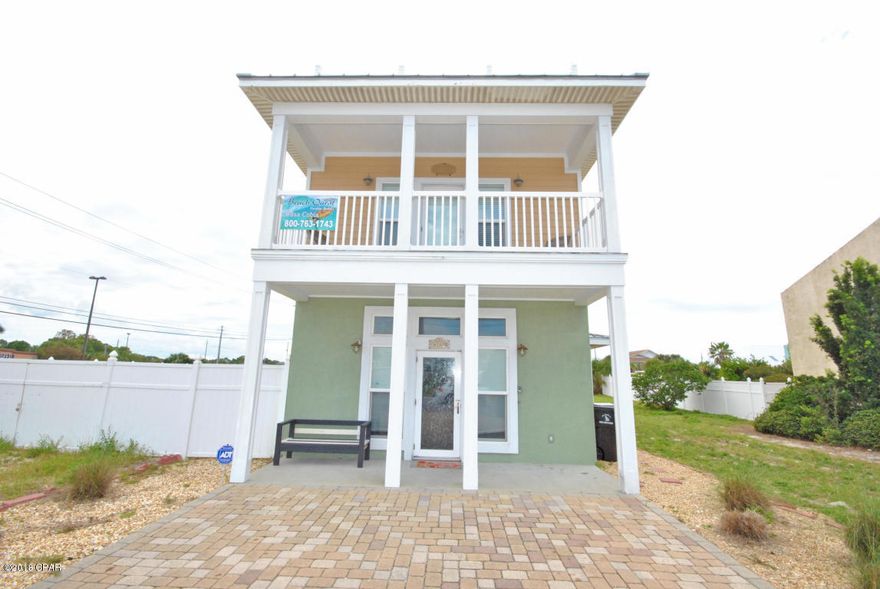Beautiful Beach House 4 bedrooms and 4 full bathrooms only steps from the beach with gulf view from second and third story leisure deck. Home features ceramic tile throughout and hardwood flooring. A great open floor plan with kitchen overlooking the family room and fireplace. Kitchen incorporates all stainless steel appliances, breakfast bar and granite counter top, new cabinets. Crown molding through out. There is a master bedroom on the 1st and 2nd floor. The first floor has a laundry room. Second floor has the additional bedrooms with each bedroom having its own full bathroom. The third floor has a great bonus room, additional bedroom with wet bar/fridge and large outside deck overlooking the gulf. The back yard has an in ground heated pool and custom paved decking throughout. Take a dip in the  salt water, heated pool after a day at the beach . The driveway is also custom paved. This home is sold fully furnished. Currently on the short term vacation rental program with 2017 revenues around $61,000 and 2018 projected at around $70,000. Fire Suppression System throughout the home.. Home has been upgraded throughout to include showers and bath. Make an offer.