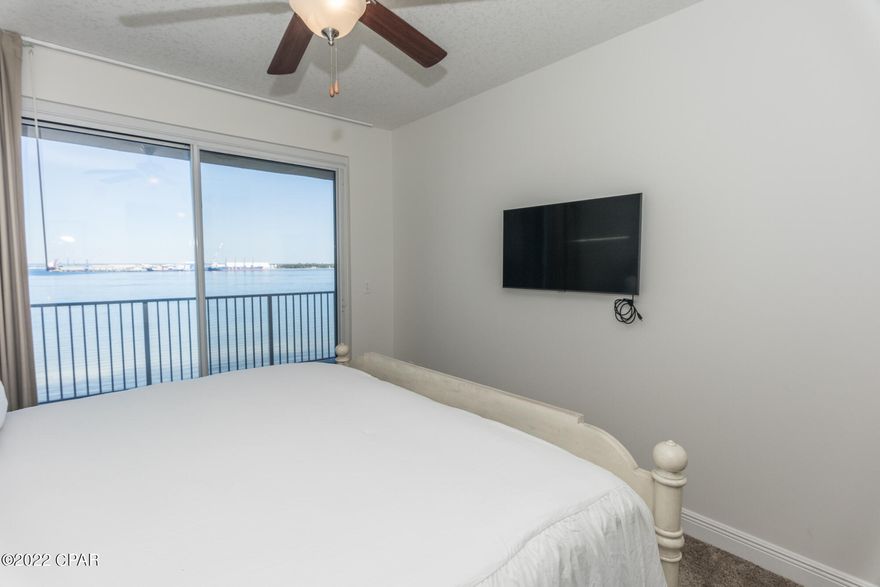 Beautiful views from this condo that comes FULLY FURNISHED at Magnolia Bay Condominiums.  This is a residential community of owners and long term renters that is pet friendly.  You will love the quiet views from a massive balcony over looking St Andrews Bay. This condo has a pristine pool area along with a dock and beach area.  Leave your paddle board or kayak bayside with the other residents to enjoy at your leisure. Call your realtor and come see this beauty today!