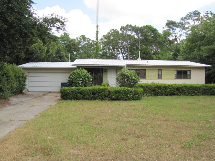 As of 9/26/2016 Seller says bring an acceptable cash or conventional contract and the Buyer will get a cashier check at closing in the amount of $10,000.00, remodel the kitchen or bathrooms. Owner financing also available with a minimum down of 25%. Forest Park home situated on 96’ X 197’mature landscaped lot.  This 3 or 4 bedroom 2 bath has a ton of potential.  The home itself has the original hardwood floors. The 4th bedroom could be used as such or a private office with a side exterior entrance.  The square footage does not take into account the finished basement area accessible from the den.  The house is cinder block construction.  In addition to the attached 2 car garage there is a detached garage/workshop. Two storage buildings and a large brick fire pit/BBQ behind the garage. Recent improvements include new central heat and air including duct work. 3 year old metal roof. Upgraded electrical panel boxes.