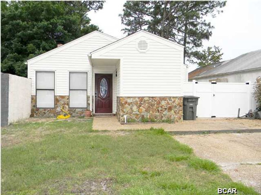 AFFORDABLE HOME NEAR TYNDALL AFB!! The interior of this home features 3 bedrooms, 2 full bathrooms and an open floor plan. The 17x14 Living Room has laminate wood flooring, a vaulted ceiling and an XL stone fireplace with hearth and mantle. The galley style kitchen was remodeled in 2010 to include new custom cabinets, attractive counter tops and black appliances. The kitchen also has a big pantry, a dark double sink, a breakfast bar and tile flooring. The dining room is tiled and has French Doors that open to the patio - perfect for outdoor/indoor entertaining. The master bedroom is big enough for a King bed and has an adjoining bath. The seller is leaving all the extra shelving and shoe cubbies to help maximize the closet space. The exterior features a good size fenced backyard, a