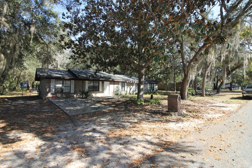 Your next Fix and Flip project is here and priced to sell! Renovate this solid brick home and reap the rewards. This 4 bedroom, 2 bath home with a well is located on a huge lot nestled among oak trees. As an added bonus, this Handyman's Dream is just half mile to the nearest boat landing. All measurements are approximate buyer must verify if important.