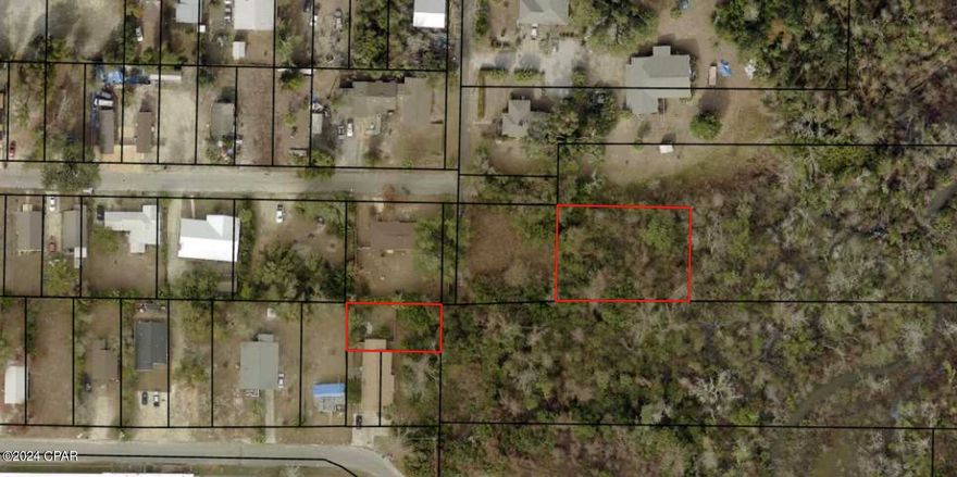 This half acre residential lot is zoned MU2. The purpose of this zoning district is to provide areas for medium-density residential development, in combination with professional offices, educational, and low-intensity, neighborhood commercial uses. Allows up to 10 units per acre. How ever there is no access to this property.