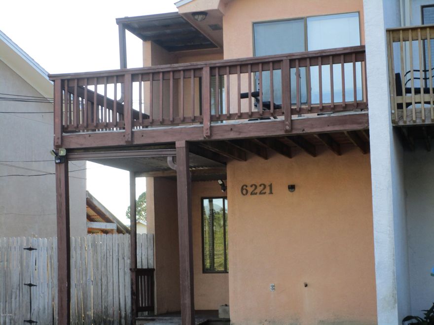 END UNIT TOWNHOUSE ** AIR CONDITIONER REPLACED 2 YEARS AGO ** SEPTIC REDONE ONE YEAR AGO ** NO HOA FEES ** TWO BEDROOMS * TWO BATHS* THREE DECKS WITH TWO ON THE SECOND FLOOR * ONE DECK HAS A VIEW OF THE LAGOON ** JUST ONE BLOCK FROM THE DOLPHIN BOAT RAMP* JUST A FEW BLOCKS FROM THE INCREDIBLE GULF** THIS IS A GREAT INVESTMENT PROPERTY, WEEKEND RETREAT OR RETIREMENT HOME