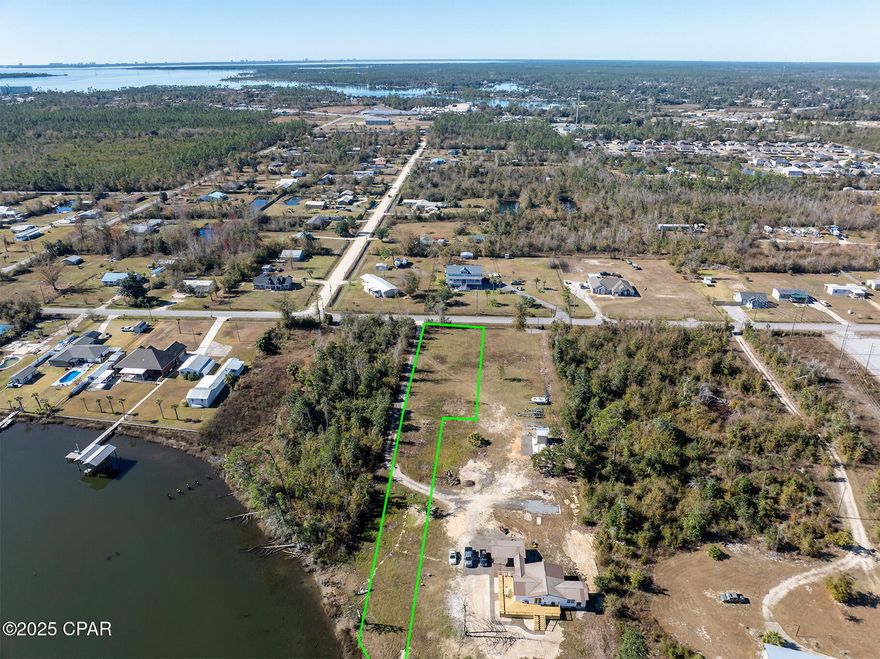 **WATERFRONT WITH DEEP WATER ACCESS! ** .88 ACRES in a great location! This property is located in Southport, FL, on Gainer Bayou . No HOA! Clear and ready to build! This property offers plenty of space for building your dream home with a waterfront view! This almost 1 Acre lot also offers 97 feet of waterfront. Fishing, Crab trapping, Kayaking and dolphin watching all from your own back yard! Build your personal boat dock with DEEP WATER ACCESS with a 25 minute boat ride to the Gulf and spend relaxing days on shell island! Only 20 minutes from Northwest Florida Beaches International Airport (ECP) 5 minutes from Lynn Haven, 30 minutes to Pier Park & Panama City Beach. Just minutes from town with a country feel! Currently, the property is clear and already has culvert with a gravel driveway. PLEASE NOTE: Seller imposed deed restrictions for this lot are limited to site built home of at least 1,200 Sq Ft. No mobile or manufactured homes permitted. Restrictions will be recorded at closing. This unique opportunity to purchase this almost 1 Acre deep water access waterfront lot in Southport with this LOCATION in Bay county and no HOA doesn't get any better!