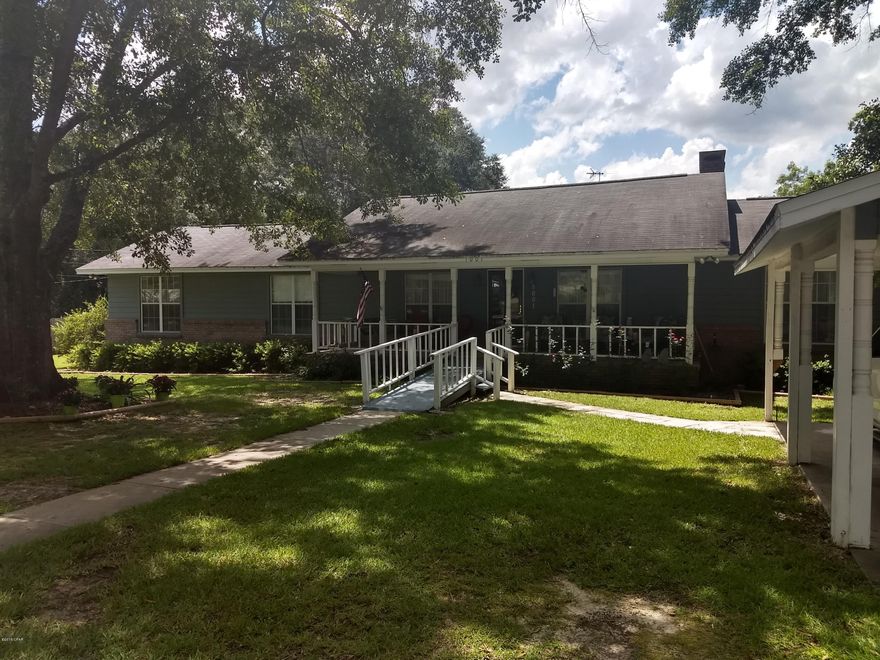 Over 2100 sf of living space. This home boasts a circular drive-way, covered carports, and Extra large Garage/Workshop with a loft in seperate building. Covered Front Porch, Large master Bedroom with double closets and extra storage. Vaulted Ceilings, Fireplace, Dual Pane Windows. Large Kitchen with stainless steel appliances and formal dining area. Also, den, and office space. Lots of storage space and inside laundry area.