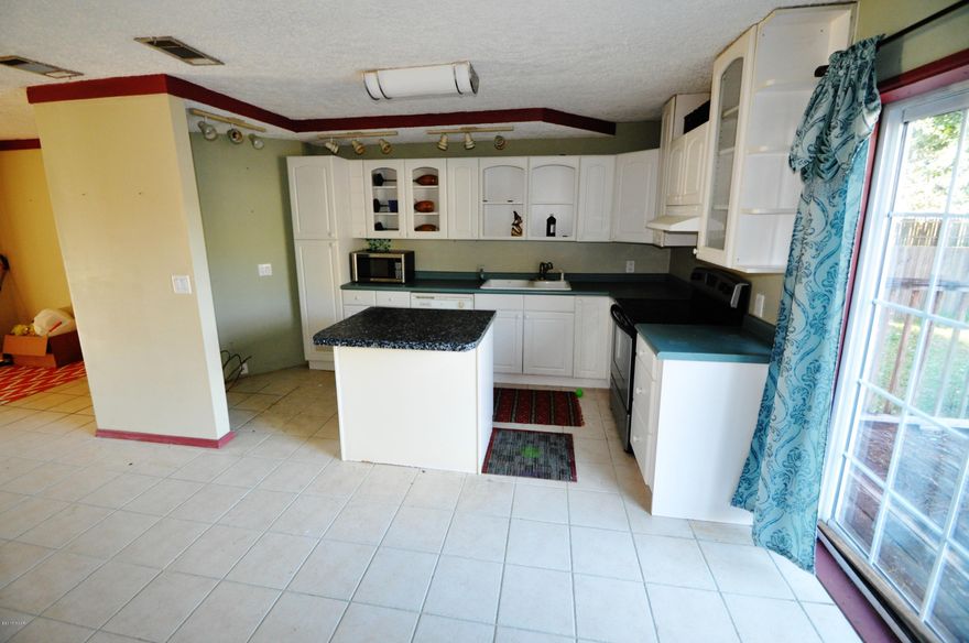 Open House! 1/23 from 10am to 2 pm and 1/24/15 from 1pm to 4pm!!This was a single family home turned into a Duplex. Corner Lot 2 blocks off 23rd St. 6'Privacy Fenced back yard. Nice deck of right end 1/2.  Pretty much move in ready with a good bath... but would make a great rental property. This is a great fixer upper..with not much work to be move in ready...Maybe you have an older Parent you need to be close to you could live on one side and them the other.... bring an offer....All sizes are approximate if they matter please measure