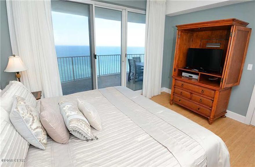 GULF FRONT, EAST END UNIT 2BR/2BA CONDO with a Gulf front master suite with sliding glass doors to one of the largest, bowed balconies (271 sq. ft.)in PCB. The property features 9' ceilings with crown molding, granite counter tops in kitchen, newer stainless steel appliances, tile flooring in kitchen, baths and living room and bamboo laminate in the bedroom. HVAC is under 2 years old. There is an owners closet outside the unit for extra storage and a dedicated, assigned parking space in the parking garage under the complex. No walking across the street for parking. Twin Palms features garage gated parking and the property amenities at Twin Palms Resort include 2 pools (one heated), jacuzzi, sauna & steam rooms, BBQ, and the world's most beautiful sugar sand beach!