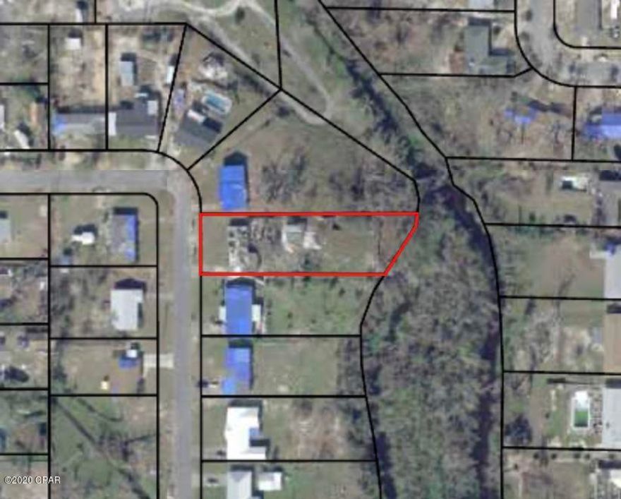 Fantastic lot located minutes from Tyndall AFB sitting on about half an acre. this lot backs up to the creek feeding Sudduth Pond and The Veterans Memorial Park walking path.. this lot features a great High and dry building sight, a huge 30x20 shed with insulated walls, power and metal roof that the seller is having repaired that would make a great work shop. this is a very large and desirable lot,