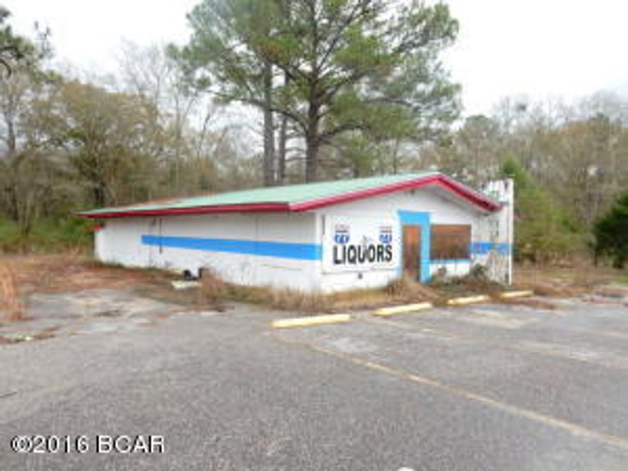 Priced to sell!! This commercial building has great potential and is conveniently located on Highway 77 between Graceville and Chipley (formerly known as Highway 77 Liquor Store). This 1644 square foot block building features, shelving, walk-in cooler, two freestanding coolers, front and back divided for rear storage, restroom, wall unit AC-Heat pump and drive thru window. Property could be used for retail store, office space, warehouse, vegetable market, flea market, or any number of ideas and has large paved parking lot. BRING OFFERS.