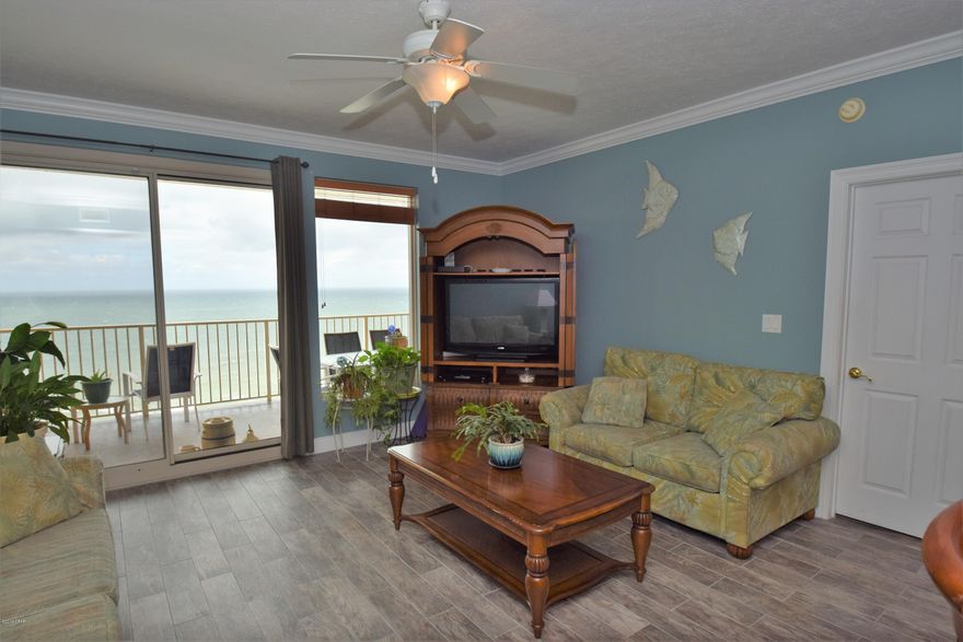 Great priced two bedrooms, two bath condo with bunks. at Treasure Island.   Located on the east end of the beach close to the State Park. Well known for their large balconies, ten-foot ceilings, and low HOA fees. This unit has been updated with new tile throughout. The living room and the Master bedroom are on the gulf side with beautiful views of the state park and the sunsets.Enjoy the Great views  from your  over sized balcony.Owner is relocating bring your buyers today...