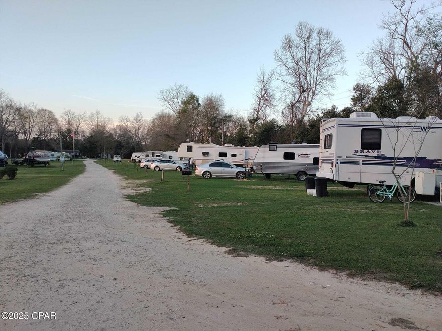 Discover this well-maintained, income-producing RV park situated on just under 6 acres of beautifully treed land featuring mature pecan, sycamore, and oak trees. The property offers 18 RV sites, each with separate electric meters, plus 2 fully rented tiny homes generating approximately $1,000/month each, and an 1,100 sq. ft. on-site manager's home. Currently, 11 long-term tenants are on month-to-month agreements, providing stable, flexible income. Infrastructure includes a crushed concrete drive built to support large RVs, a loop water system, four septic tanks, and underground utilities in conduit. Tenants enjoy a spring-fed pond, three picnic areas, coin-operated laundry, fiber optic internet, and security cameras with lighting throughout the property. This park is thoughtfully designed for low-maintenance management and long-term growth—an excellent opportunity for investors seeking a strong cash-flowing asset with expansion potential. 💼 Investors - Bring All Offers! Don't miss this rare chance to own a thriving, turnkey RV park with proven income and room to grow.