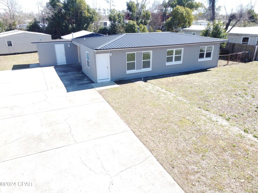 New to the market! Beautiful 3/1 home with great proximity to downtown St. Andrews. This home includes a cozy kitchen with stainless steel Whirlpool appliance package. A spacious Florida room located off the dining room. Luxury vinyl plank and tile throughout, no carpet. Block home wrapped in vinyl offers low maintenance along with new windows.  New metal roof in December 2018. Huge heated and cooled Florida room. 2 storage buildings and nice sized yard. This home has great proximity to downtown area of St. Andrews with some of the best local restaurants anywhere and also has seasonal events like Mardi Gras and is host to farmers markets on Saturdays. Launch your boat at St. Andrews Marina, from there it's just a short boat ride to the Gulf of Mexico or Shell Island. Excellent proximity to Panama City Beach and TAFB. Schedule your visit today!