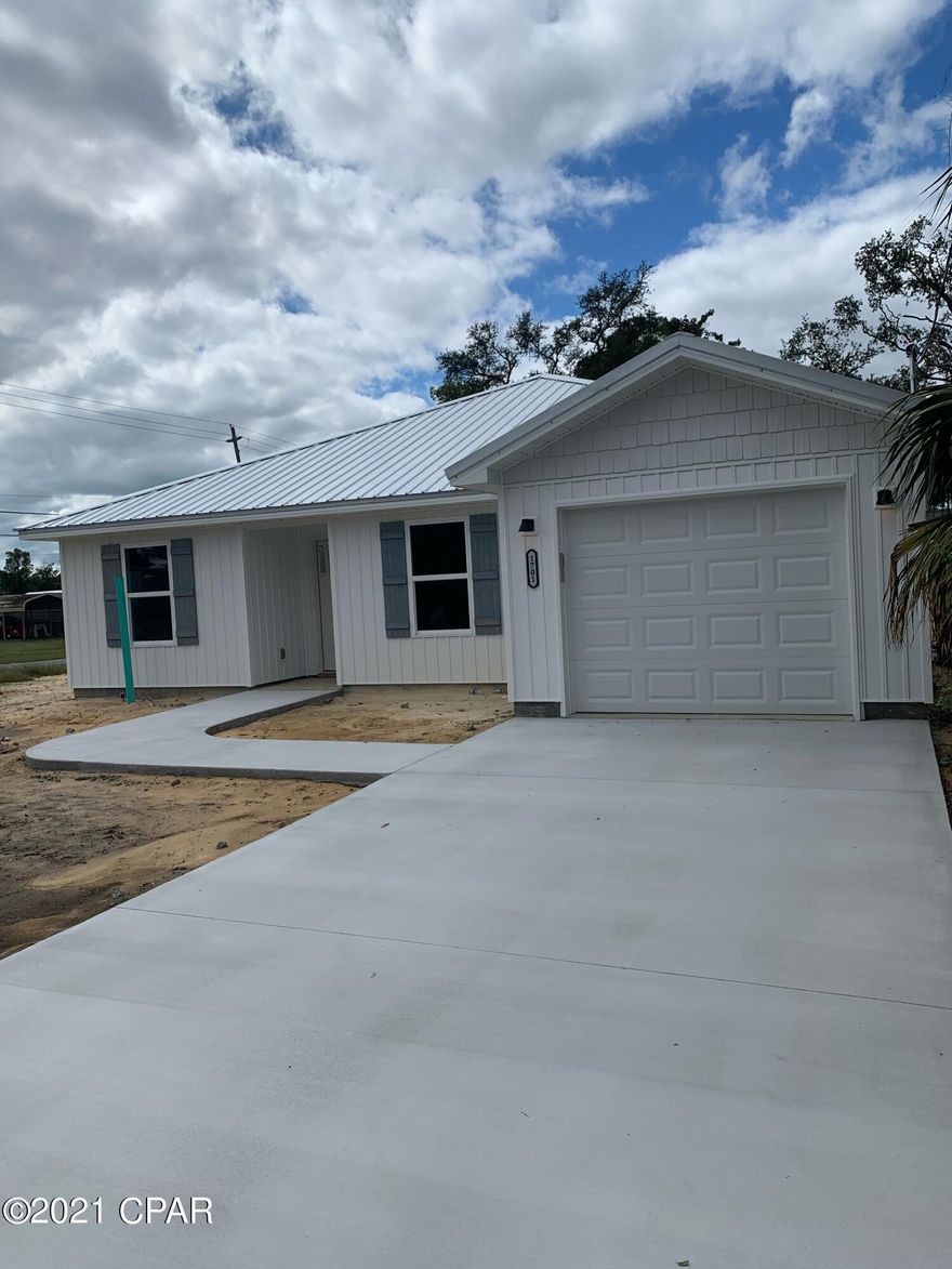 ST ANDREW'S , NEW CONSTRUCTION! This 3/2 features loads of CRAFTSMAN STYLE CHARM and is located in a great neighborhood close to all area  amenities; ST ANDREW MARINA, restaurants, GULF COAST STATE COLLEGE, FSU and a just a quick trip to the beaches. On the inside is an OPEN FLOOR PLAN that includes a spacious kitchen offering BEAUTIFUL QUARTZ COUNTER TOPS, STAINLESS APPLIANCES and WHITE SHAKER STYLE CABINETRY. The living area has a coffered ceiling and a great view of the back yard. The dining space includes an over sized breakfast bar and room for a large table. The master bedroom is tucked into a private corner and has walk in closet and a bath with double vanity. The outside features a metal roof, open porch, garage and privacy fenced yard. Hard to find all this at an affordable price!