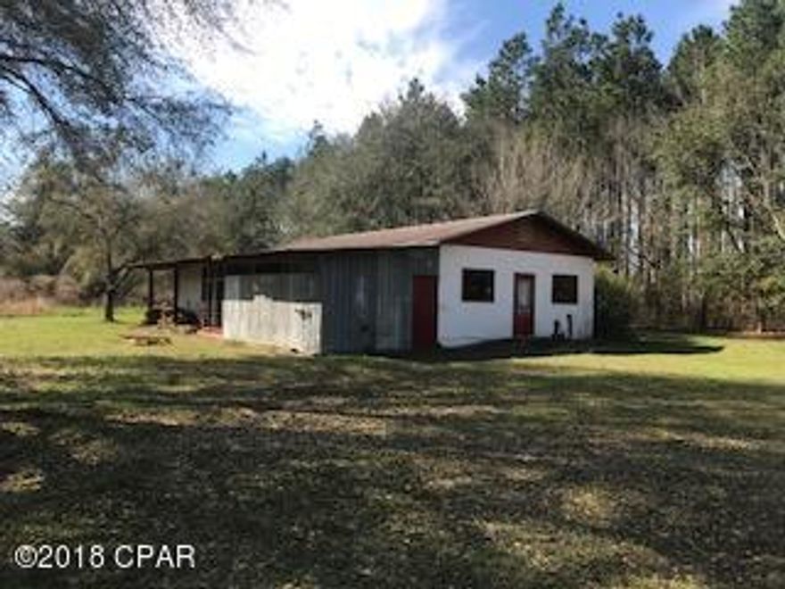 5.2 Acre parcel in beautiful country setting.  Property has a Block Building on it that was formerly used as a Smokehouse.  Building has a restroom in it.  Little value has been given to the building but with a little TLC it could be usable.  **Buyer should get a survey to verify property lines and size.**