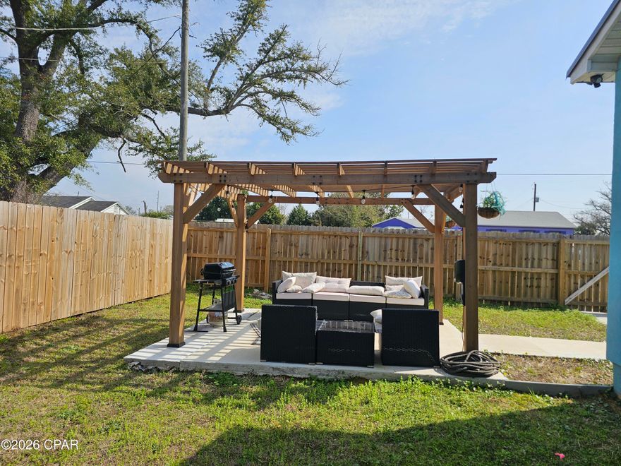 Open living and kitchen area with lots of room for the family. Beautifull kitchen with eat-in bar, corian tops and SS appliances. Large family room for all your furniture with high ceilings. Bedrooms are good size with plenty of room and the big master bedroom offers large closet and a custom master bathroom and access to back patio. Hall bathroom is a custom look and lots of room. Laundry room with lots of storage space and the house offers lots of closet space. Corner lot that offers privacy fence and a yard building for more storge. Close to everything and can be used as short rental income. Close drive to Tyndall Air Base. Tour today. If important all information and measurements should be verified.