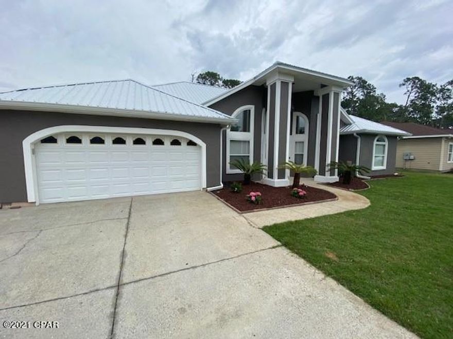 Currently under contract, seller accepting back up offers.  4 bedrooms and 3 baths! Close to the Navy base, golfing and dining.  Fresh paint inside and out and recent improvements include: Kitchen Aid appliances, metal roof, water heater 2017, HVAC 2018, Ring door bell and flood lights 2018, well pump 2021 new bedroom carpeting.  Master bedroom is a peaceful retreat with access to the covered patio and has a large bathroom with separate jetted tub, shower and water closet and vanity with double sinks. Across the home are two bedrooms who share a bathroom and also a 4th separate bedroom with a full bathroom.  Two flex spaces in the home for dining, office. Seller offering one year home warranty.  Privacy fenced yard.