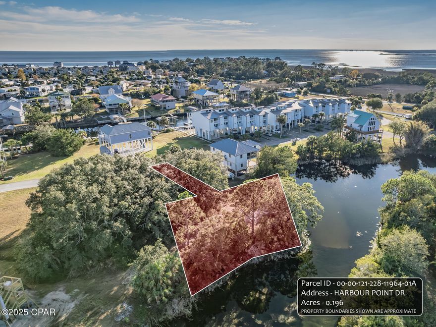 This is a great buy in the beautiful golf cart community of Shell Point!  Build your dream beach home on this lot that is set off the street and backs up to a small lake with beautiful views and natural wildlife.   This unique lot is in the gated community of Snug Harbour and is within a 1/2 mile to Shell Point beach! Tap fees for water and utilities will be paid through Talquin Electric.  Snug Harbour provides a community pool with 1/2 bathrooms. Just steps away is a designated boat slip with water and electricity for your boat or sailboat. HOA fees include use of the pool, dock utilities and maintenance, and mowing of the lot.  Enjoy the pool after a long day of being out on beautiful Apalachee Bay!  At Shell Point you will enjoy amazing sunsets, a relaxing atmosphere and lots of community events, festivals, and concerts. This lot is priced to sell!