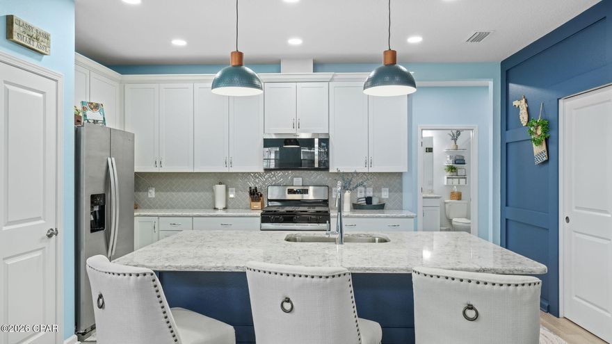 A beautifully designed Mango Cottage with a desirable bonus den, located in the award-winning 55+ community of Latitude Margaritaville Watersound.

This highly sought-after floor plan offers bright, open living spaces perfect for entertaining, plus a versatile den ideal for a home office, hobby room, or additional guest space. The Mango Cottage is a community favorite for its efficient layout, coastal-inspired design, and comfortable indoor-outdoor flow with many upgraded interior features.

Situated in the close-knit 6BC neighborhood, you'll enjoy a true sense of community with weekly get-togethers and popular Friday potlucks at 6BC Park -- where neighbors quickly become lifelong friends. It's the perfect blend of privacy and connection.

Latitude Margaritaville Watersound has been named among the Top 50 Master-Planned Communities in the U.S. offering resort-style pools, fitness center, dining, live entertainment, clubs, and endless activities designed for active adults who want to make the most of every day.
Located near the scenic Intracoastal Waterway and just a short golf cart ride to the amenities and the white-sand beaches of Panama City Beach, this home combines coastal beauty with an unbeatable lifestyle.