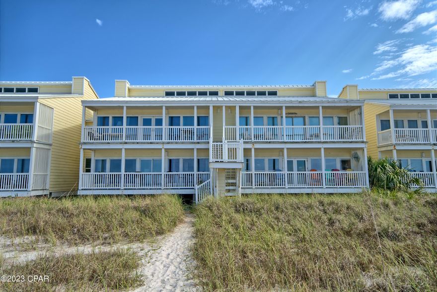 A coveted first-floor unit in Harbur Arms, situated on the serene west end of Panama City Beach, FL.  Just a few miles away from 30A, this gem features expansive wall-to-wall uninterrupted ocean views, bathing interiors in natural light from the living room dining room, kitchen, and master bedroom. Delight in direct beach access from your back door. Enjoy your long private balcony with lots of high Polywood seating and immerse yourself in the stunning panoramic views of the gulf and emerald waters. With only a few other units in this complex, a generous expanse of beachfront feels intimate and less congested, offering a rare tranquility. The recent renovations elevate the living experience: indulge in a newly remodeled kitchen adorned with premium cabinetry, granite, stainless steel appliances. Large comfortable bedrooms with direct access to one of the three spa-inspired bathrooms, complete with contemporary walk-in showers. Additionally, enjoy the convenience of a dedicated parking spot, located mere steps from your entrance. A true embodiment of luxury beachfront living awaits you.