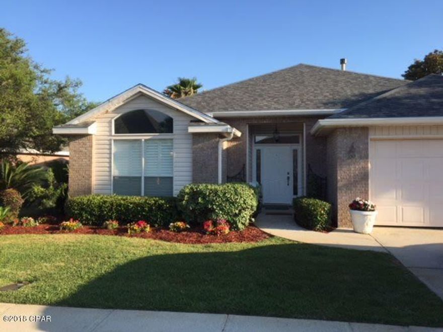 Lovingly maintained two-owner, custom home built in 2000 that has never been rented...Just under 1,800 sq ft (heated and cooled, 2,363 sq ft under roof) of open floor plan with 3 bright bedrooms and 2 baths...New 20-year architectural shingle roof applied in April of 2018 with wind mitigation certificate...Floor to ceiling screened porch allows sun and beach breezes to flow through house, preferred southern exposure for beautiful light throughout ...Split bedroom plan with large master features huge arched window views to private back yard...Back perimeter surrounded by natural wood shadowbox privacy fence...Kitchen features neutral granite countertops and island...Whole house water filter...Spacious Great Room with tiled natural gas fireplace with three tall telescoping glass doors.