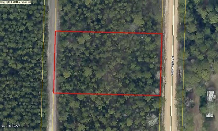 1 acre wooded lot perfect for building or developing! (All measurements and school zones are approximate and need to be verified by builder if important.)