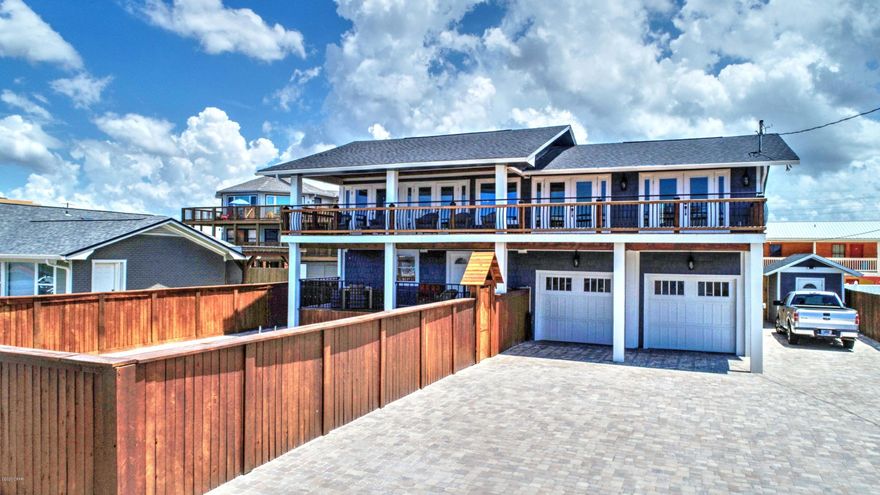 One of a kind Beach Home with a FANTASTIC LOCATION! Oversized Living at its finest! Across the Beach and steps away from Public Beach Access. This would be a Great Rental or Get Away Home! Enjoy Endless Sunsets on the Beautiful Balcony while Overlooking views of the Gulf and your own Private Pool. This 4 bedroom home has been completely remodeled inside and out with no expense spared! Relax with Indoor/outdoor living Vibes as the living area opens up to the Oversized balcony making this a great entertaining space! Both the Master and second bedroom/office open up to the balcony as well. Vaulted ceilings with crown molding make for a spacious feel. Split floor plan and open concept. Bring the Boats and RV's as this home also has an Oversized driveway and a 672 sqft heated and cooled garage!