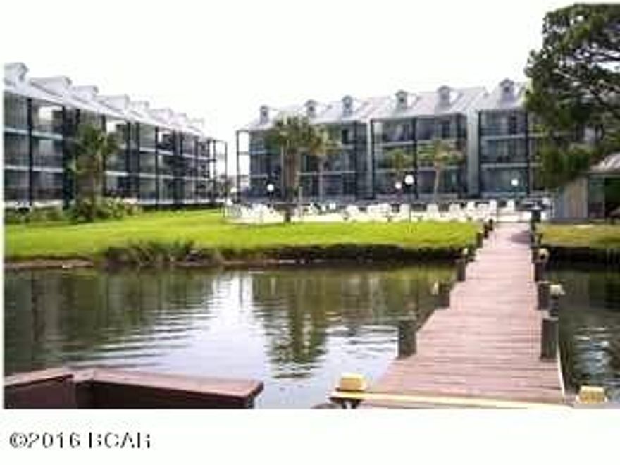 FULLY FURNISHED 1 BEDROOM CONDO ON THE SECOND FLOOR OF 3 STORY COMPLEX.  UNIT BALCONY FACES GRAND LAGOON. COMPLEX FEATURES A POOL AND DOCK.