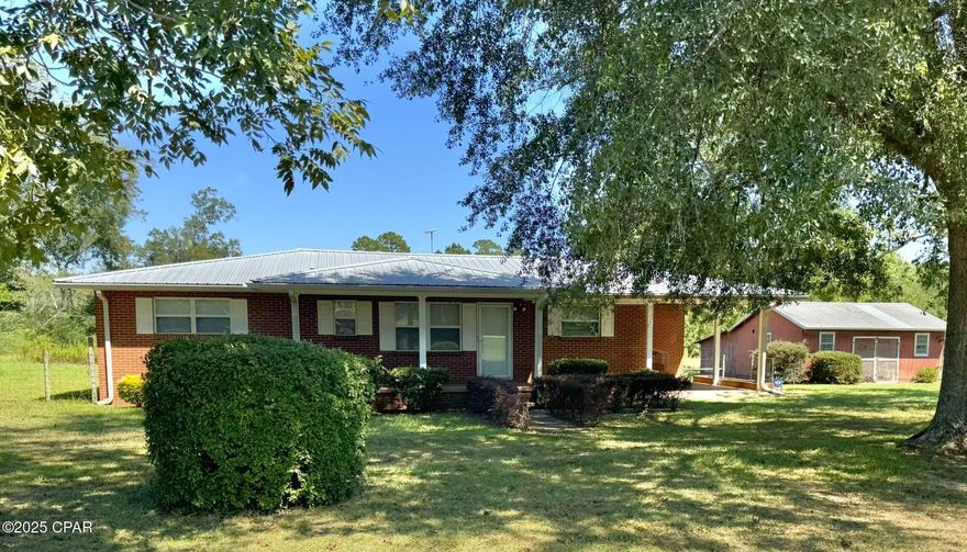 Tired of the city chaos? Want to escape to a peaceful country retreat? Well, you're in luck because this place is the ultimate country chill spot! It's only 1 mile from the Graceville city limits, where you can get your seafood fix, 5 miles from the Alabama State line, and just minutes from Chipley, Florida. This two-bedroom, two-bath BRICK home is the epitome of country cool, with an en suite setup, a metal roof, central heat and air, and a well, septic, and appliances that'll make you feel like a country king. And don't even get me started on the closet space - the master bedroom has three closets! The bathrooms are rocking that retro tile vibe that's all the rage among buyers these days. And, because every country home needs a barn, this place has a 24 x 21 barn with power and a lean-to. So, what are you waiting for?