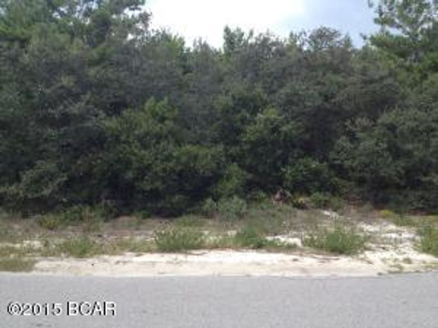 ***SELLER WILL FINANCE WITH 25% DOWN, 6% RATE, 30 YEAR AMORTIZATION,3 YEAR BALLOON*** Build your dream home in the up and coming west end of PCB, or a $$$ generating triplex, your choice! Great 77x137 corner lot that with a 2 story home, might give you a gulf view!