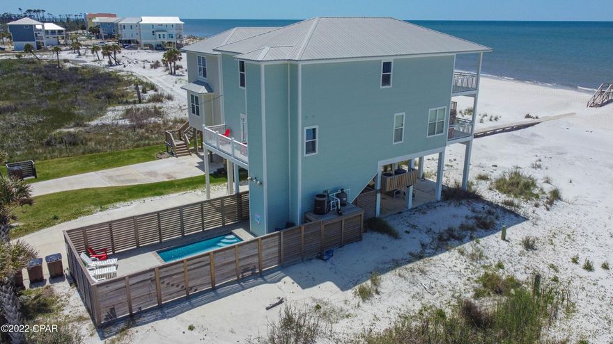 Currently under contract, seller will consider backup offers.  Impressive GULF FRONT home offers spectacular views and easy access to the beach. A pool surrounded by louvered fencing ensures privacy while your family enjoys the pool and sunning area. Two Gulf-front King masters also add to the appeal of this house making it a very popular rental. With 4 bedrooms, 4.5 bath, the open floor plan is very welcoming and makes for easy entertaining your entire family - home also has an elevator for convenience. 2nd (main) floor of the home features lots of dining options inside and outside on balcony, half bath for guests and the first of large rooms. The top floor showcases two grand bedrooms with private access to Gulf facing balcony, bunk room and the washer/dryer.  See attached 3D tour.