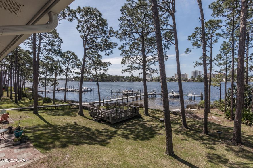 WHAT A BEAUTIFUL VIEW OF THE GRAND LAGOON...THIS SECOND FLOOR CONDO FACES GRAND LAGOON   YOU HAVE VIEWS FROM THE BALCONY,LIVING AREA AND KITCHEN....THIS CONDO HAS BEEN BEAUTIFULLY UPDATED WITH GRANITE COUNTER TOPS IN KITCHENAND FARMHOUSE SINK, TILE FLOORS AND WOODEN PLANK CEILING THRU OUT THE CONDO...THERE ARE BOATS SLIPS YOU CAN LEASE BY PUTTING YOUR NAME ON THE LIST EVEN THOUGH THERE IS A WAITING LIST IT IS WORTH THE WAIT...OWNERS PETS ARE ALLOWED!!!!!!!!!!!!!



SELLER SAID TO PRESENT ALL OFFERS!!!!