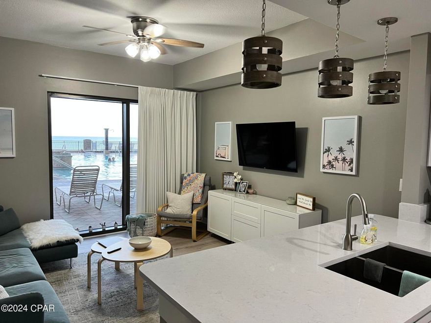 CURRENTLY UNDER CONTRACT, SELLER WILL CONSIDER BACKUP OFFERS.  1 of 7 condos on the pool/amenities deck of Origin.  The only 1 bed 1.5 bath, 957 square feet unit, with a private sliding glass door directly to the pool deck.  Just as you enter, you are greeted with the wall of windows leading your view across the beautiful pool and hot tub, directly to the Gulf of Mexico!  Unit 424 was fully renovated in 2022 with all new furniture, new paint, quartz counters in the kitchen and bath, new bathroom vanities, new fixtures, new appliances, new TVs, new hot water heater, and new composite patio furniture that will not rust or rot in the salt air.  This condo would make a great short term rental investment, however, has been used as a primary residence for the last 2 years.  Not looking to rent, 424 makes a great place to call home, or your own personal vacation condo on the beach!  Located across the street from Sharky's beachfront restaurant and bar, and within walking distance to Pier Park, Gulf World, and a multitude of dining and entertainment options.  Origin offers many amenities including two BBQ grill/picnic areas, a heated pool, hot tub, theater, game room, laundry facility, vending. a gated community with 24 hour security, and retail on site including Starbucks coffee, convenient store and grill, and Sunsations.  Call today to schedule a showing before the opportunity or own this one of a kind unit at Origin passes you by!