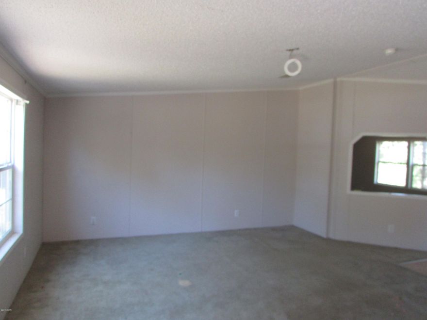 Large Home located in Altha!! 4 Bedrooms 2 baths with 2280 sq ft heated/cooled! Located on 1.86 acres! This home can be made into the perfect home with some TLC. Kitchen has lot of cabinet space and center island and pantry! Master bedroom has a sitting room or attached nursery! The master bath has separate shower, garden tub and double sinks. Priced to Sell!! Sold AS-Is. Call today for your personal showing!!!