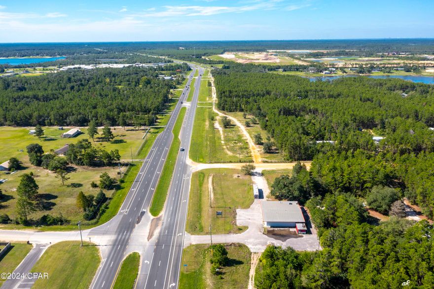 Prime Investment Opportunity - Versatile 4,800 SF Steel Building on 1.24 Acres with Hwy 77 Frontage! Investors, take note! This high-visibility commercial property on rapidly growing Hwy 77 is a rare find with endless potential. Spanning 4,800 square feet (3,600 heated/cooled), this steel-constructed building sits on a spacious 1.24-acre lot with ample parking and easy trailer access--ideal for high-traffic businesses. Highly Sought-After Access: There is a dedicated ingress/egress right in front of the property on State Hwy 77, making entry and exit seamless for customers and delivery vehicles--a major advantage for any business. Built for Business: Featuring a commercial-grade septic system for a restaurant, an existing kitchen hood range, and a drive-through setup, this property is ready for a quick launch into the food, retail, or service industry. Strategic Location & Growth Potential: With prime Hwy 77 frontage, this site benefits from maximum visibility and heavy traffic flow, making it a prime investment in Bay County's booming northern expansion. A 140-home community is currently under construction just one mile away, ensuring an influx of future customers. Versatile & High-ROI Potential: Whether you envision a restaurant, retail space, service hub, or franchise, this turnkey property is positioned for strong returns as the area continues to grow. Don't miss this opportunity to secure a high-demand commercial asset in a rapidly expanding market! Schedule a tour today to discuss the possibilities.