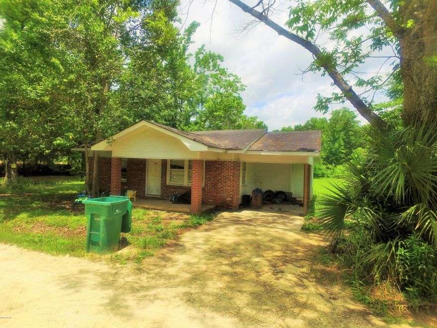 Home would make a great rental property.  It is a two bedroom, one bath home that needs some TLC but has great potential. Attached carport and a out building will come with this purchase.  There are two additional homes adjoining this home that is also on the market.  One is a nice brick home on approx 3.5 acres and the other would make a great rental also.  Subject is PROPERTY ''2'' on aerial in photos.