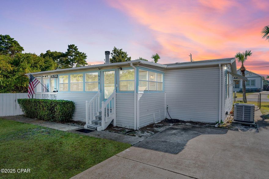 Welcome to Seahaven Beach House! This Fantastic three-bedroom, two-full bathroom home is situated on an oversized corner lot, just half a mile from the nearest beach access, and has NO HOA fees.
 This immaculate, turnkey home is waiting for its new owner. The current owner has meticulously upgraded the property with exceptional attention to detail including all new plumbing/fully re-piped in 2020, new toilets, new sinks and faucets, newly re-surfaced tub in the guest bathroom, newly resurfaced shower in the primary bathroom, brand new water heater in 2025, new paint throughout, all new lighting, new barn doors, all new flooring, new blinds throughout, new fans, new back splash in the kitchen, wine fridge and re-finished kitchen cabinets! The spacious primary bedroom features a walk-in closet and double sinks in the ensuite. Step outside and you will find a large partially fenced in corner lot with plenty of room for your boat, golf cart and RV! There is also an outdoor shower, large screened in porch, blooming citrus trees, new spotlights and a workshop with electricity. This home truly checks all of the boxes!!! Would make a great Primary residence, 2nd Home or Airbnb. 
Conveniently located just a few miles from Pier Park, offering easy access to entertainment, diverse restaurants, and extensive shopping options. Additionally, it provides a direct route to the beautiful white sandy beaches and emerald waters. Inquire today to discover why Northwest Florida remains one of the most highly sought out areas and start living the coastal lifestyle you deserve.