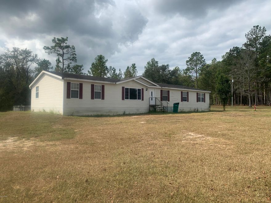 JUST REDUCED! Country living at its best!  This large home sits on a spacious 5.57 acres in Caryville.  There is a stocked pond with fish to feed the neighborhood.  The home features a large living room, family room with fireplace, master bedroom & three additional bedrooms.  The spacious kitchen is perfect for family gatherings & the dining area will accommodate a large dining room table.  With the separate living room & family room, everyone can have their own space to relax.  Enjoy the enclosed back porch along with the open deck beside the above ground pool.  Two sheds on property.  This home & property is the perfect place to raise your horses & kids.  Ride during the day, fish in the afternoon & eat in the evenings!  Bus stops in front of home.  Home is in need of new roof.
