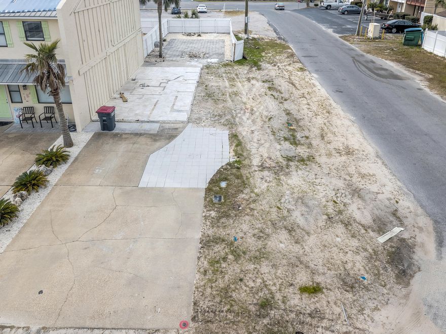 Affordable Residential CORNER lot in Panama City Beach! Build your vacation tiny home or go a few stories up to capture a view of the emerald gulf waters. The prior attached home has been destroyed by the Hurricane and lot is cleared and clean. Water meter on site. Prior unit shared septic next door, tank located next door. New owner is NOT required to build attached (per PCB planning & Zoning depto). Buyer to verify all information