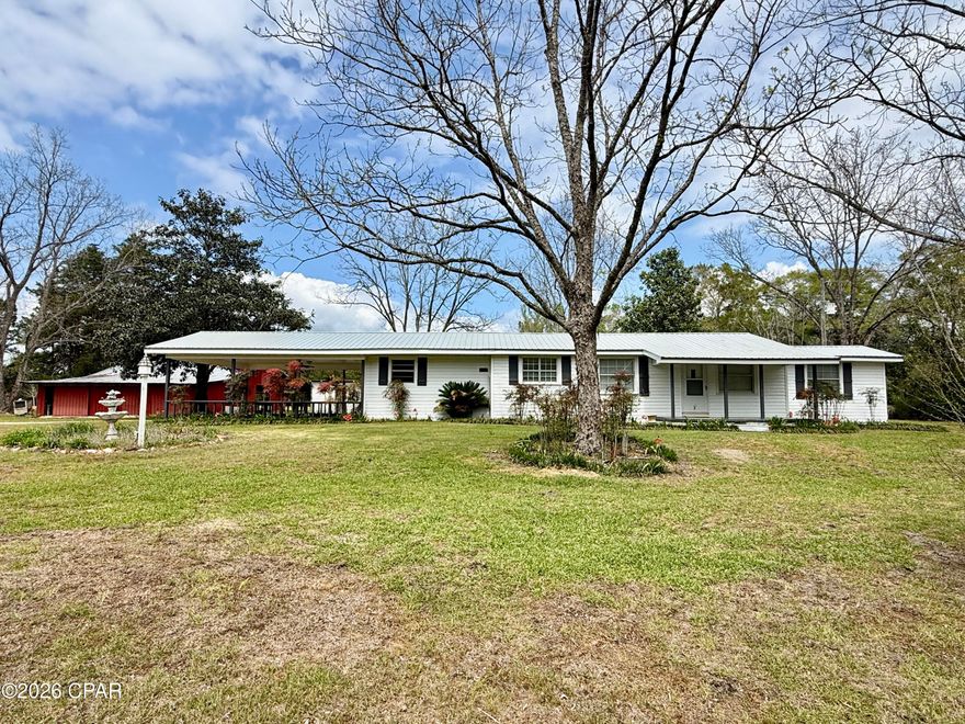 Welcome to peaceful country living in the Westville community of Holmes County, Florida. This 3 bedroom, 2 bath home built in 1955 sits on approximately 5 acres, offering a quiet setting with plenty of space to enjoy the outdoors.

The property features a classic rural homesite with mature pecan trees, scattered shade trees, and country landscaping, adding lots of character. The land offers a great mix of open yard and usable acreage, ideal for a small homestead, gardening, or simply enjoying the country lifestyle.

Recent improvements include brand new vinyl siding and an updated HVAC system (2019), new granite countertops, new metal roof - giving buyers peace of mind while still allowing room to personalize the interior to their taste.

Inside, the home offers a comfortable layout with a spacious living area and laminate hardwood flooring, along with a functional kitchen that provides plenty of cabinet space. The home has solid bones and is perfect for someone looking for a move-in ready home with potential to update over time.

Outside, you'll also find a barn/shop building--perfect for storage, equipment, or hobby use.

Located on a paved road with good frontage, this property offers easy access while still maintaining the privacy and feel of true country living.

Whether you're looking for a starter home, investment property, or a quiet place in the country, this one checks all the boxes.